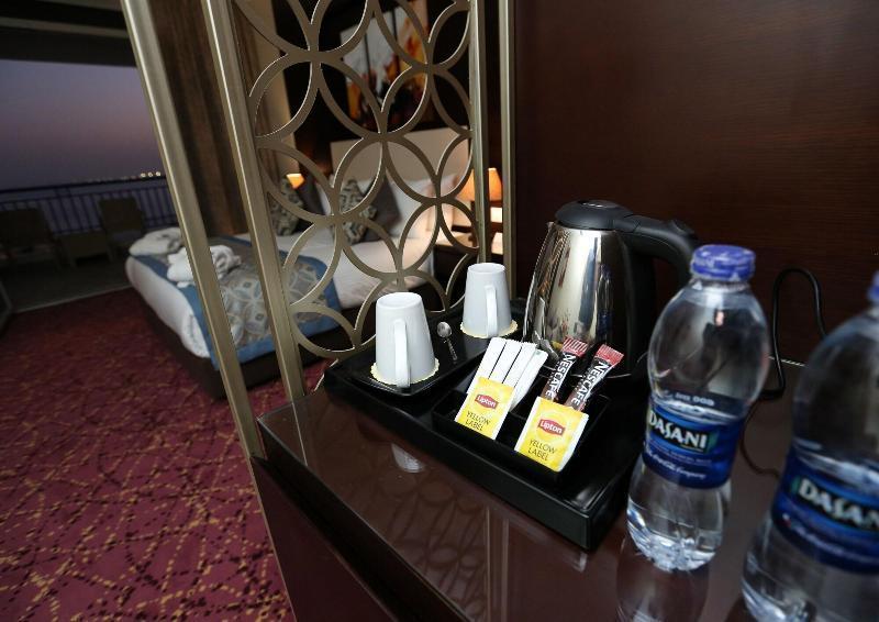 Tolip El Forsan Hotel Ismailia Eksteriør bilde Bottled water in a hotel room